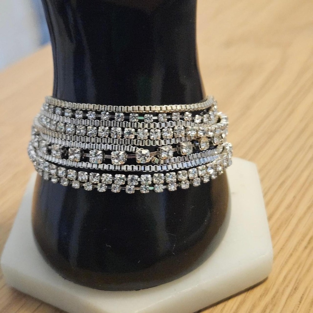 Silver tone rhinestone bracelet with multiple rows of clear crystals